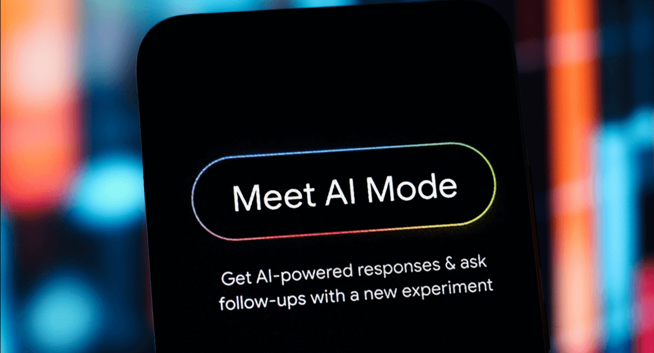 Schermata di smartphone con la scritta “Meet AI Mode”, che presenta una nuova funzionalità basata su intelligenza artificiale.